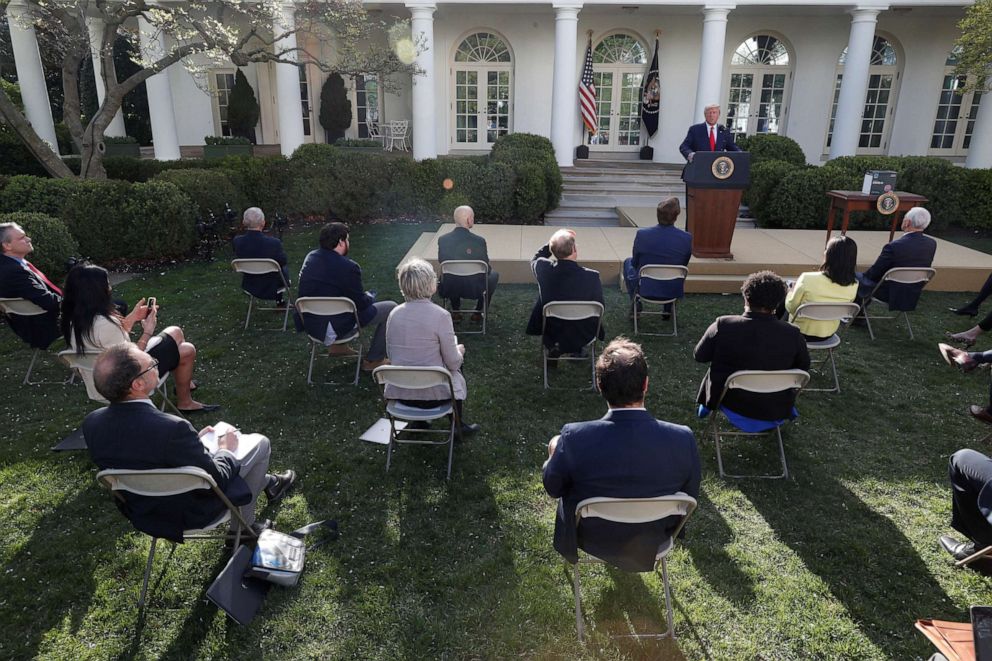 PHOTO: Reporters sit at a safe distance from each other listening to President Donald Trump as he addresses the daily coronavirus response briefing in the Rose Garden at the White House in Washington, March 30, 2020.