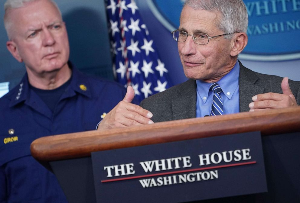 PHOTO: Director of the National Institute of Allergy and Infectious Diseases Anthony Fauci speaks as Admiral Brett Giroir listens during the daily briefing on the novel coronavirus, COVID-19, at the White House on April 6, 2020, in Washington.