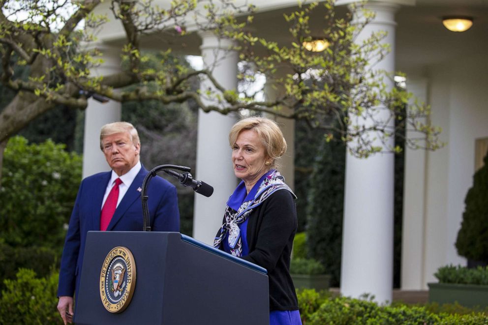 PHOTO: President Donald Trump listens to White House coronavirus response coordinator Deborah Birx speaks in the Rose Garden for the daily coronavirus briefing at the White House on March 29, 2020, in Washington.