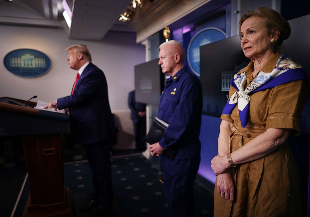 PHOTO: White House coronavirus response coordinator Deborah Birx listens to President Donald Trump speak to reporters at the White House on April 6, 2020, in Washington.