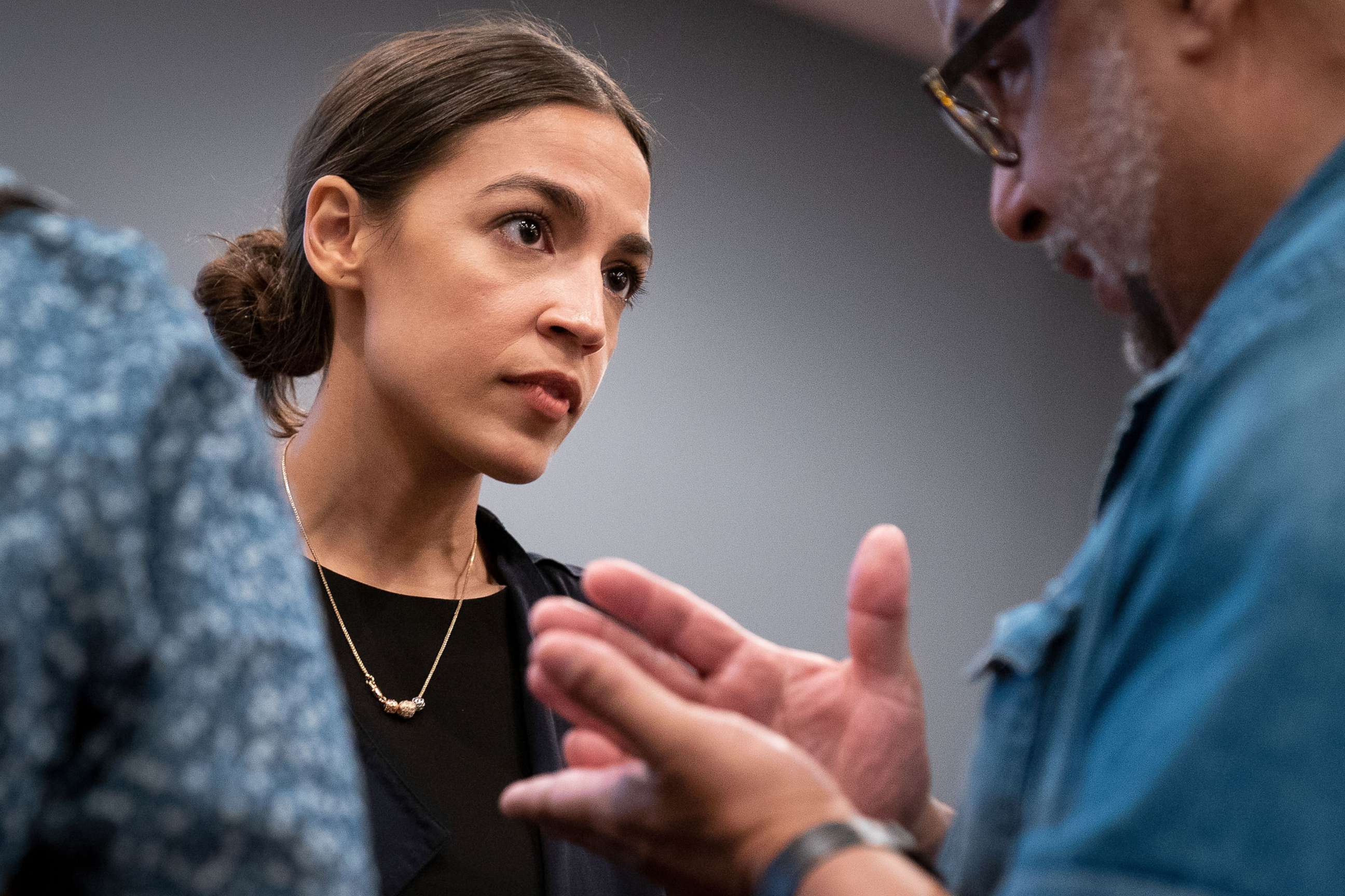 PHOTO: Alexandria Ocasio-Cortez, Democratic candidate running for New York's 14th Congressional district, talks with a voter at the conclusion of a town hall event, Sept. 19, 2018 in The Bronx borough of New York.