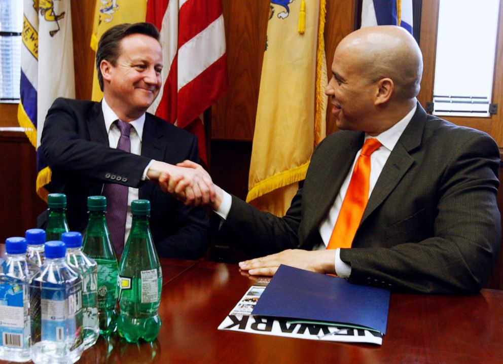 PHOTO: British Prime Minister David Cameron shakes hands with Mayor Cory Booker at City Hall during a meeting in Newark, March 15, 2012.