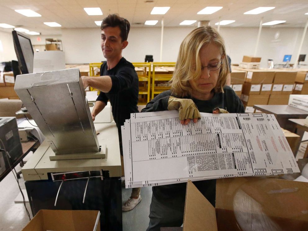 PHOTO: Workers organize ballots at the Maricopa County Recorders Office Thursday, Nov. 8, 2018, in Phoenix.
