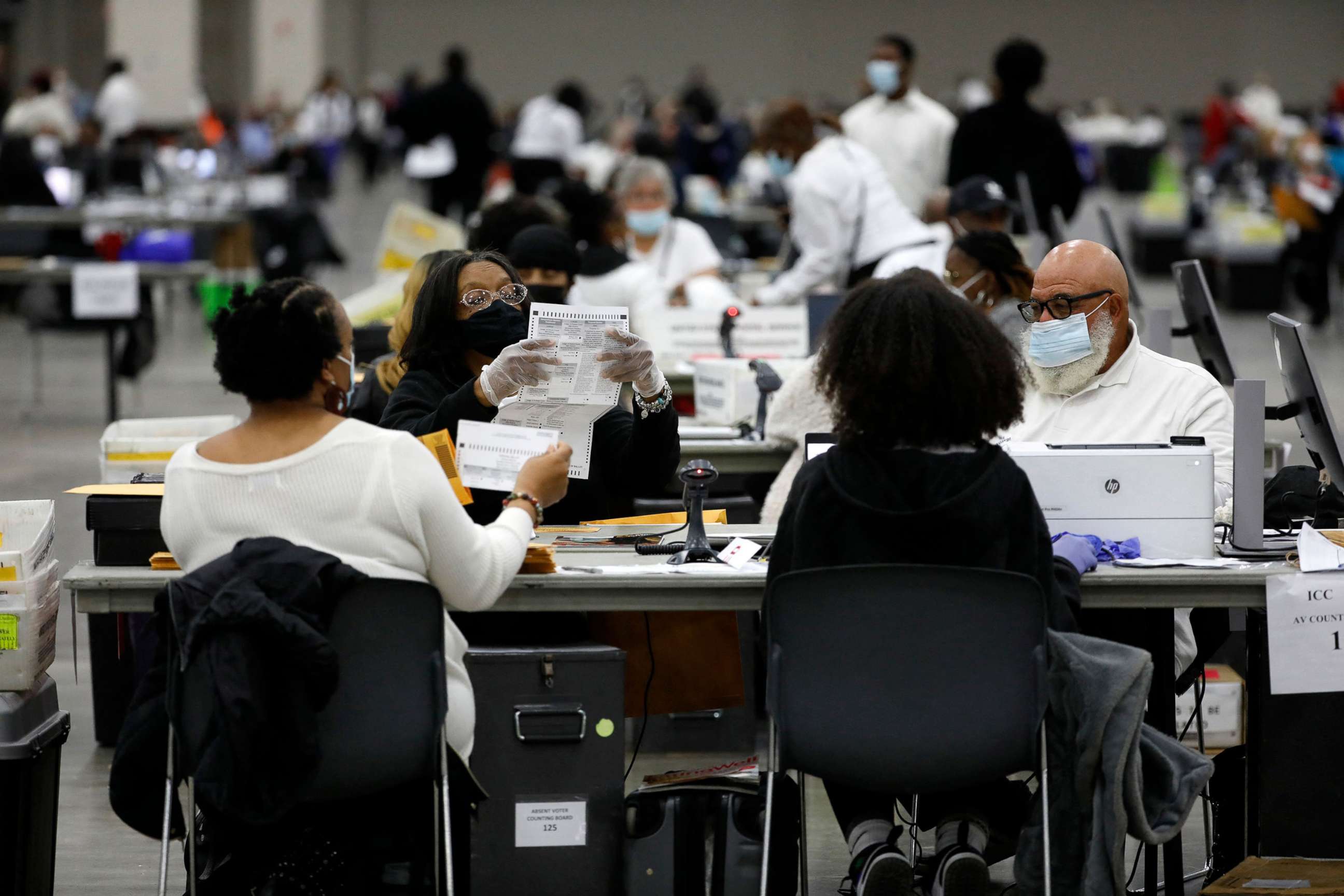 PHOTO: Election workers process absentee ballots cast in the U.S. midterm election, at Huntington Place in Detroit, Michigan, Nov. 8, 2022. 