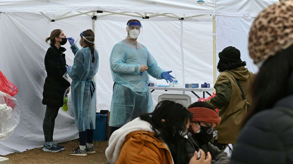 PHOTO: People get tested for COVID-19 at a testing site in Washington, D.C., Dec. 29, 2021.