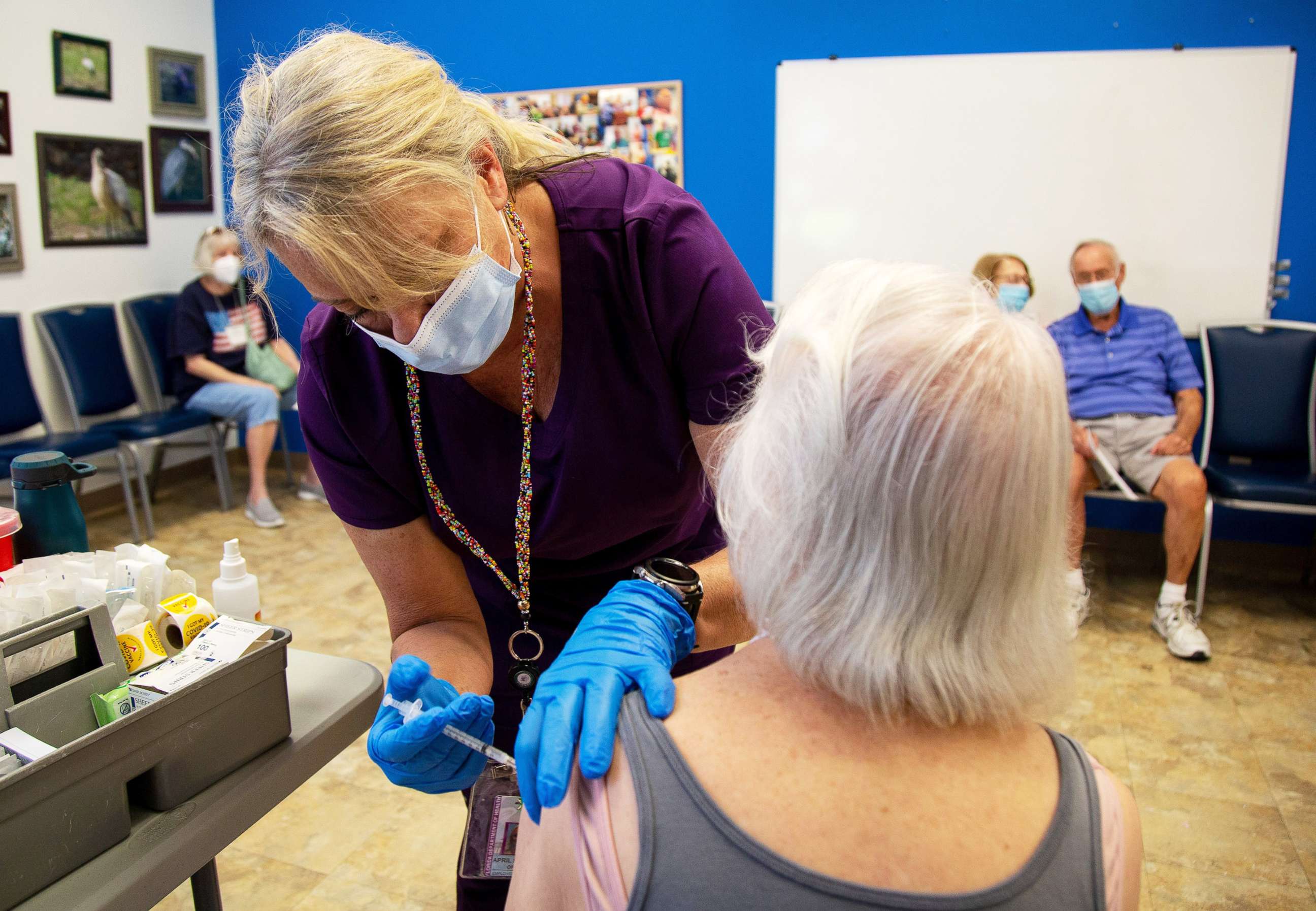 PHOTO: April Smith of the Collier County Health Department gives a COVID booster shot at the Naples Senior Center in Naples, Fla., Nov. 1, 2021.