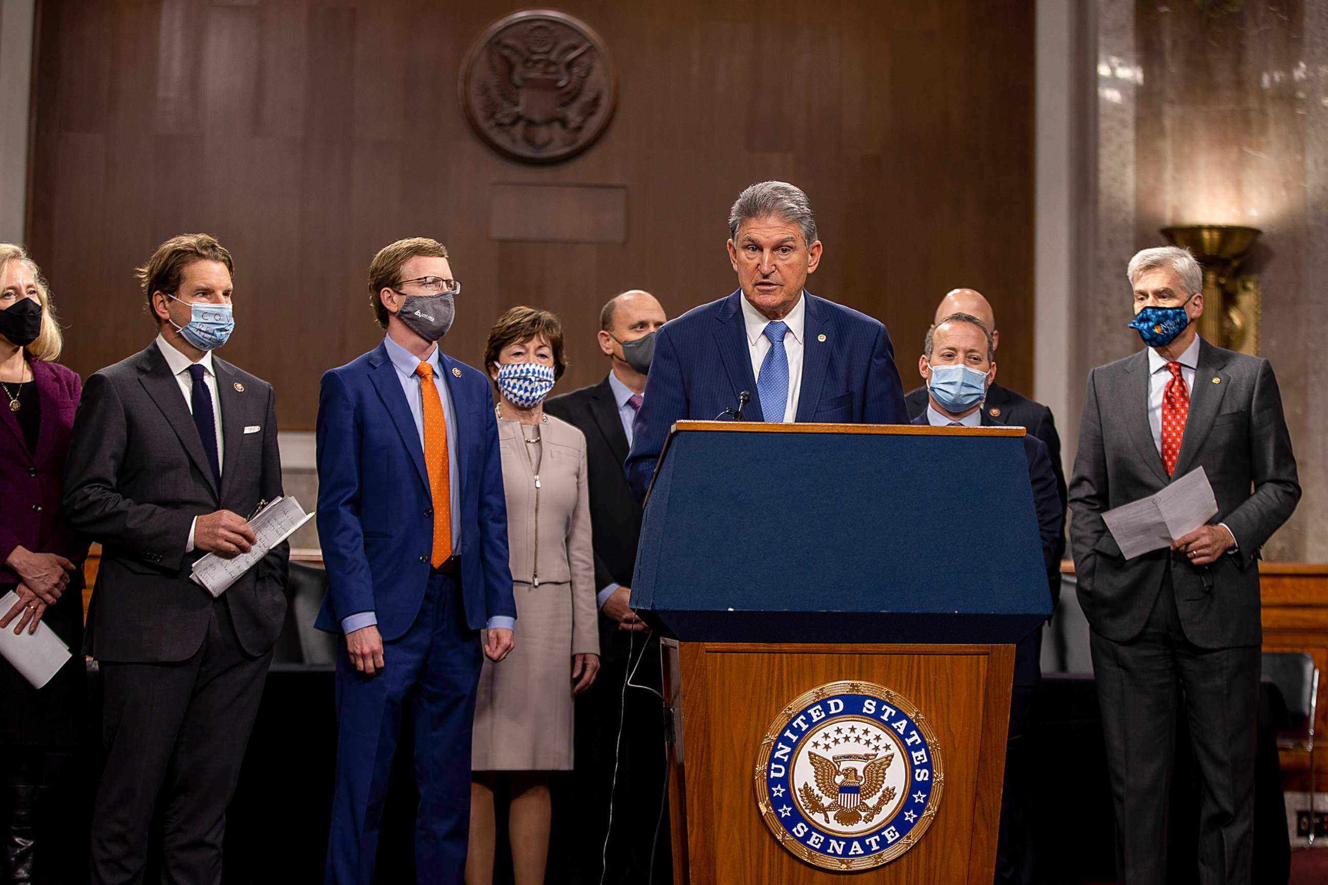PHOTO: Sen. Joe Manchin (D-WV) speaks alongside a bipartisan group of Democrat and Republican members of Congress as they announce a proposal for a Covid-19 relief bill on Capitol Hill, Dec. 1, 2020.