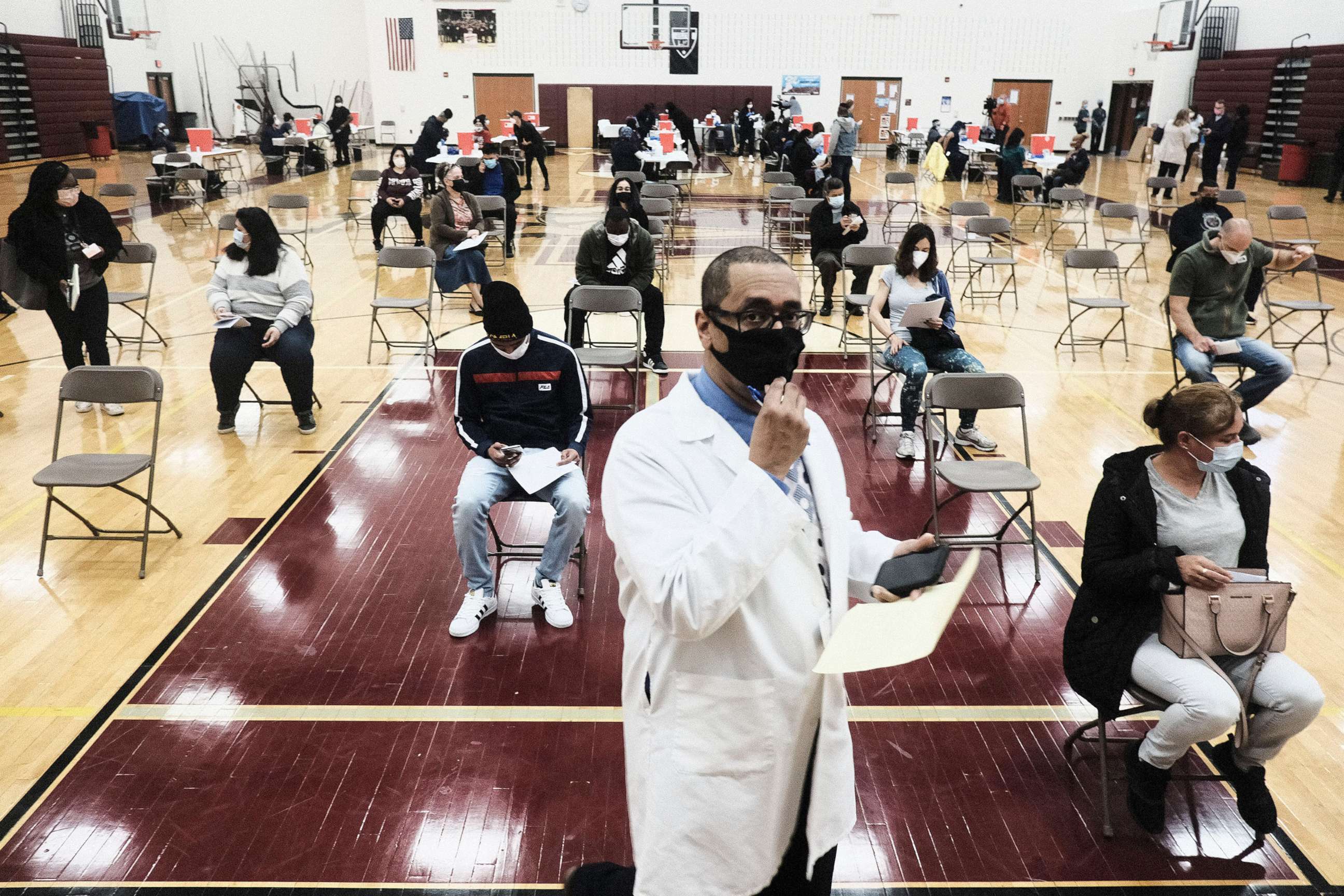 PHOTO: Medical staff watch and advise walk-in patients who received their COVID-19 vaccination at a pop-up clinic at Western International High School, April 12, 2021, in Detroit.
