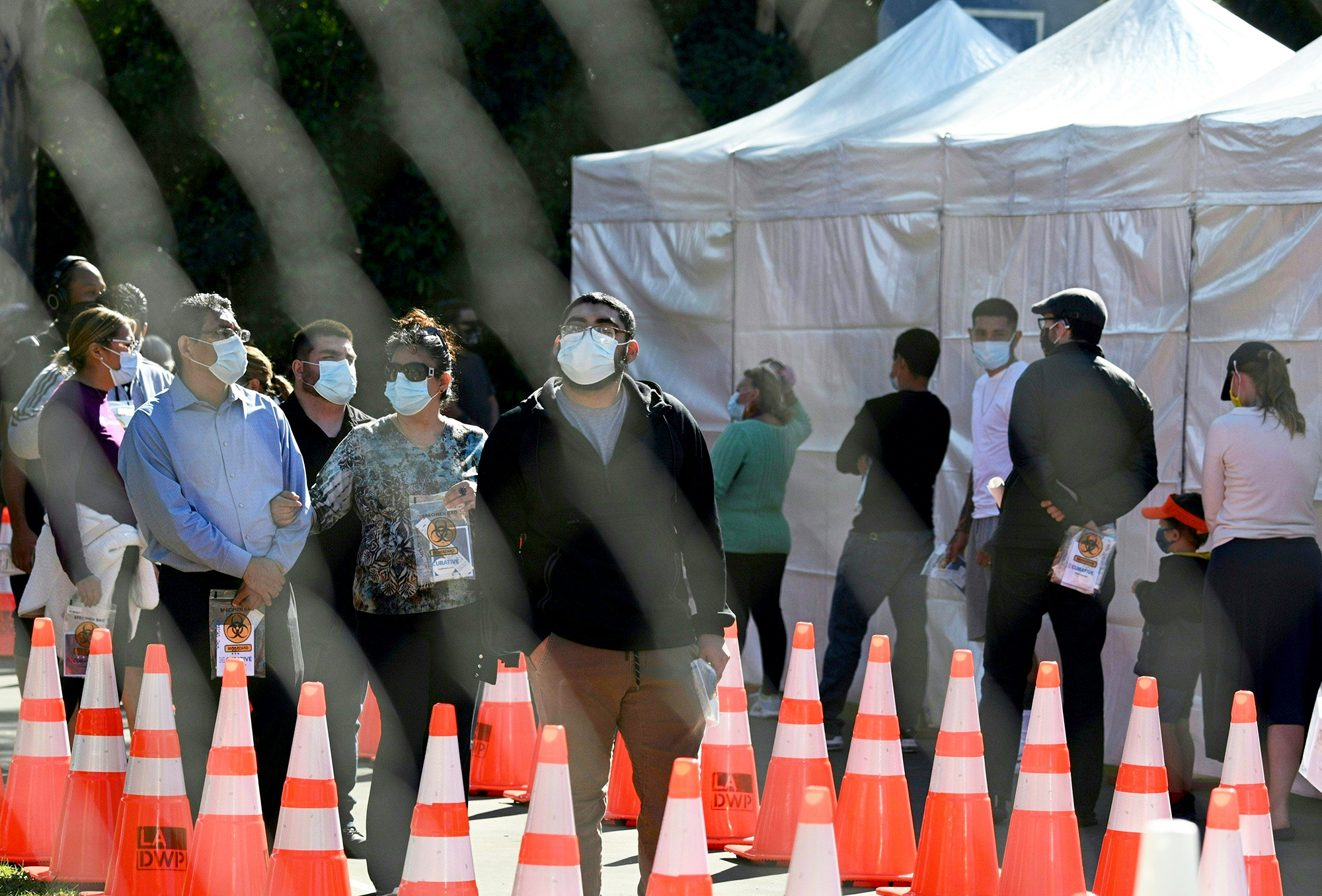 PHOTO: People wait in long lines for coronavius tests at a walk-up Covid-19 testing site in San Fernando, Calif., Nov. 24, 2020.