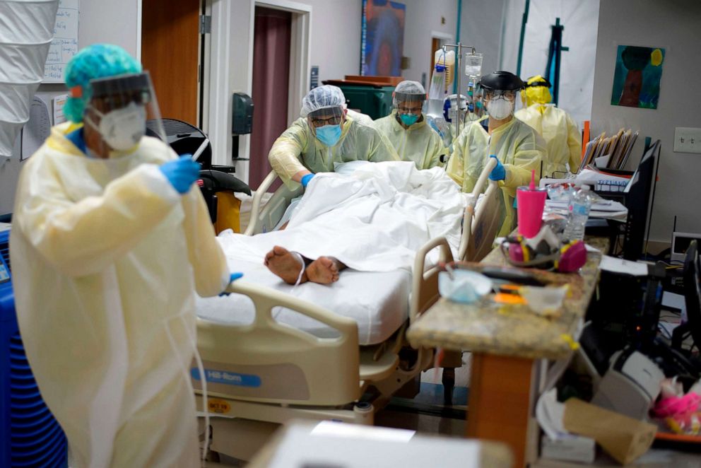 PHOTO: Healthcare workers move a patient in the Covid-19 Unit at United Memorial Medical Center in Houston, July 2, 2020.