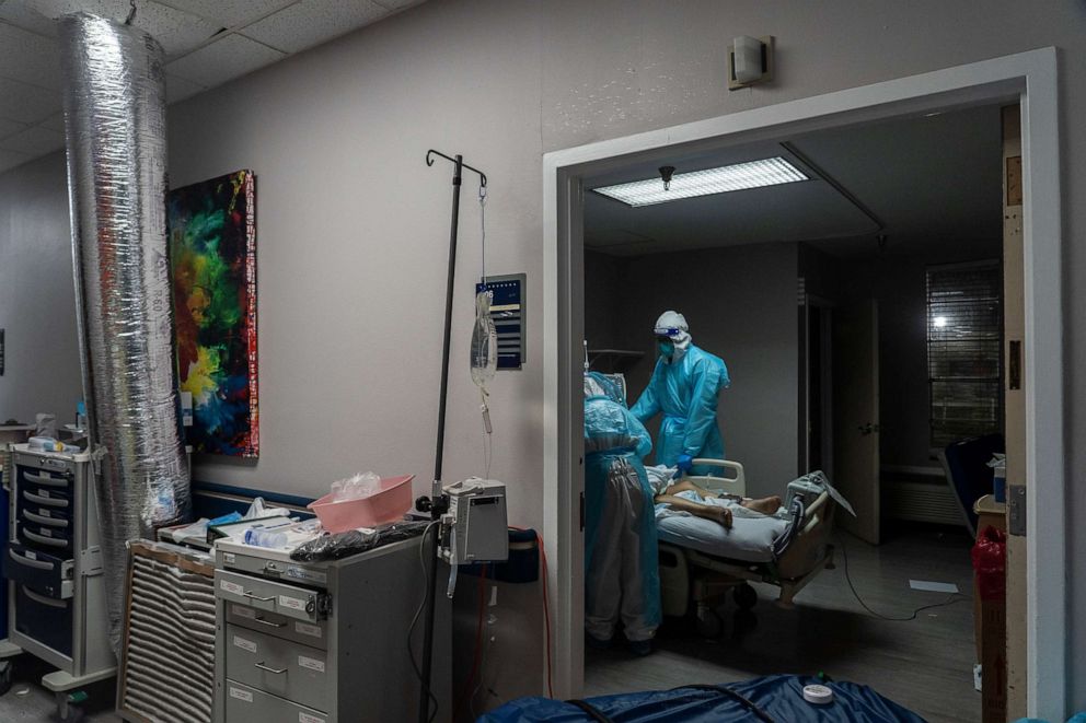 PHOTO: Medical staff treat a patient suffering from the coronavirus in the COVID-19 ICU at the United Memorial Medical Center on Nov. 19, 2020, in Houston, Texas.