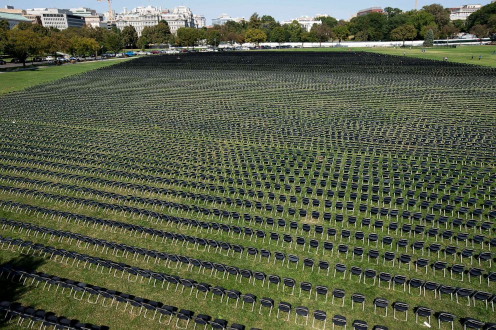 PHOTO: Empty chairs who represent a fraction of the more than 200,000 lives lost due to COVID-19, are seen during the National COVID-19 Remembrance, at The Ellipse outside the South side of the White House, Oct. 4, 2020, in Washington.