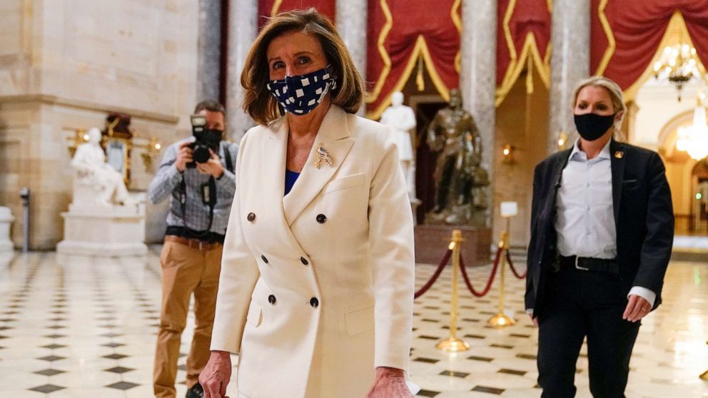 PHOTO: House Speaker Nancy Pelosi of Calif., walks through Statuary Hall, after the Democrat's $1.9 trillion COVID-19 relief bill passed on Capitol Hill, March 10, 2021, in Washington.