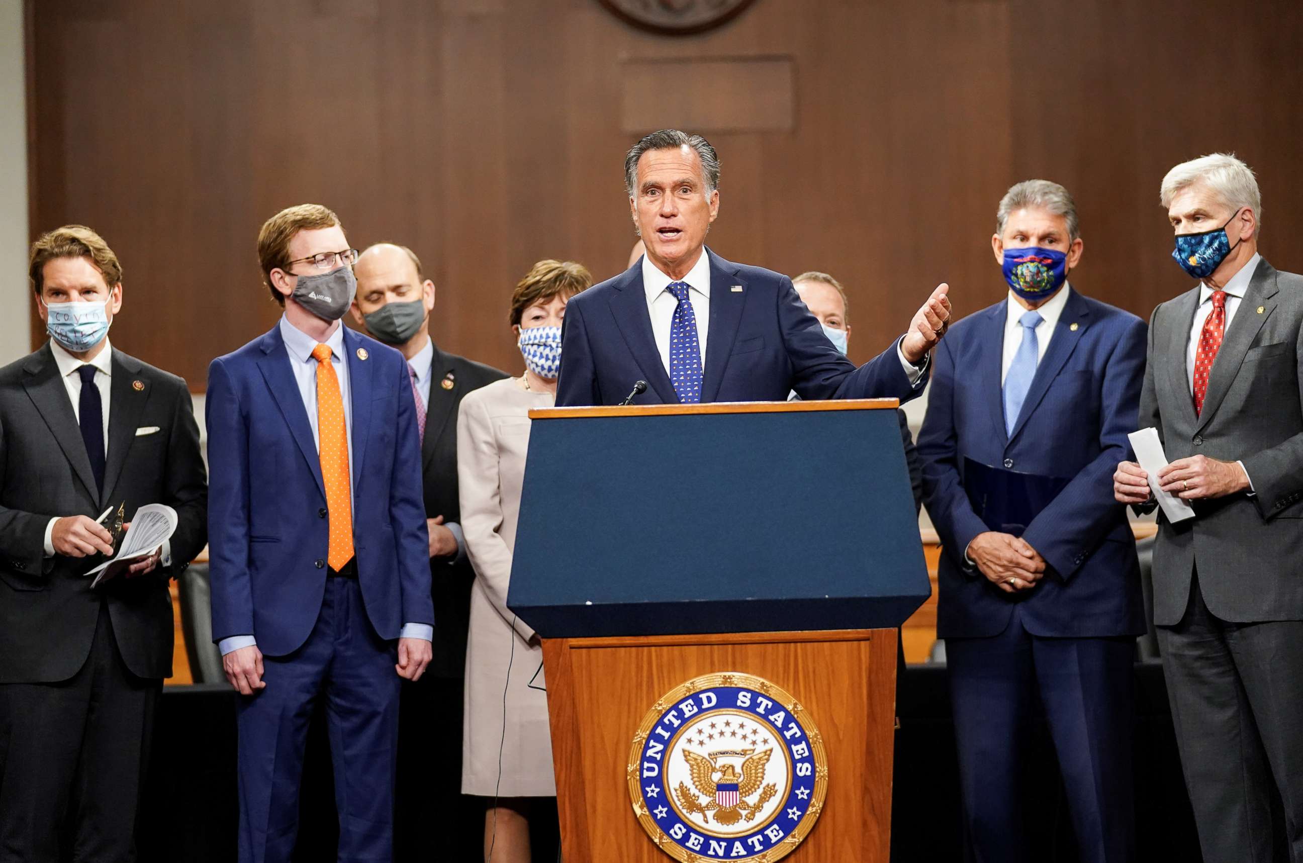 PHOTO: Senator Mitt Romney speaks as bipartisan members of the Senate and House gather to announce a framework for fresh coronavirus disease (COVID-19) relief legislation at a news conference on Capitol Hill in Washington, Dec. 1, 2020.