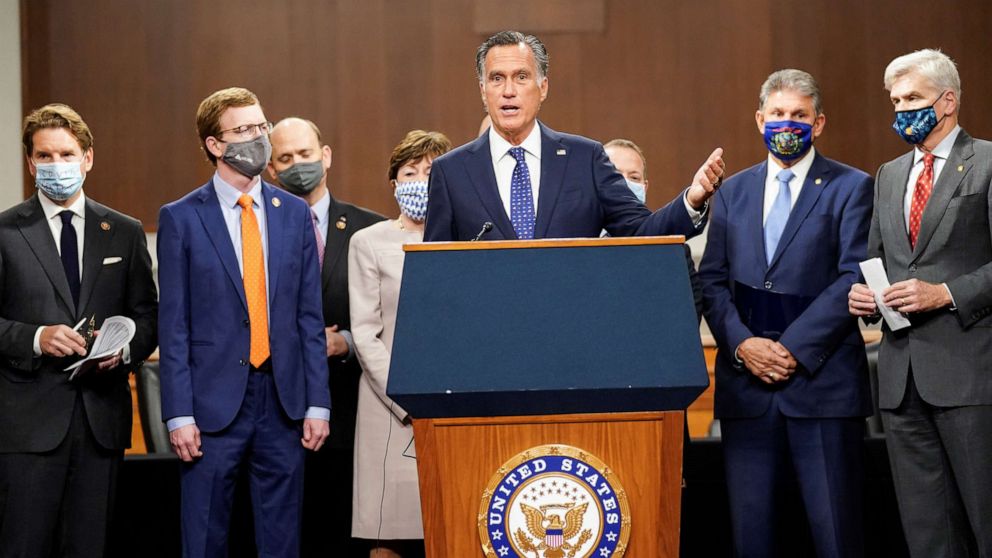 PHOTO: Senator Mitt Romney speaks as bipartisan members of the Senate and House gather to announce a framework for fresh coronavirus disease (COVID-19) relief legislation at a news conference on Capitol Hill in Washington, Dec. 1, 2020.