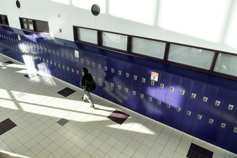 PHOTO: A student walks the halls between classes during the first day of in-person learning at Arvada West High School in Arvada, Colo., Jan. 25, 2021.