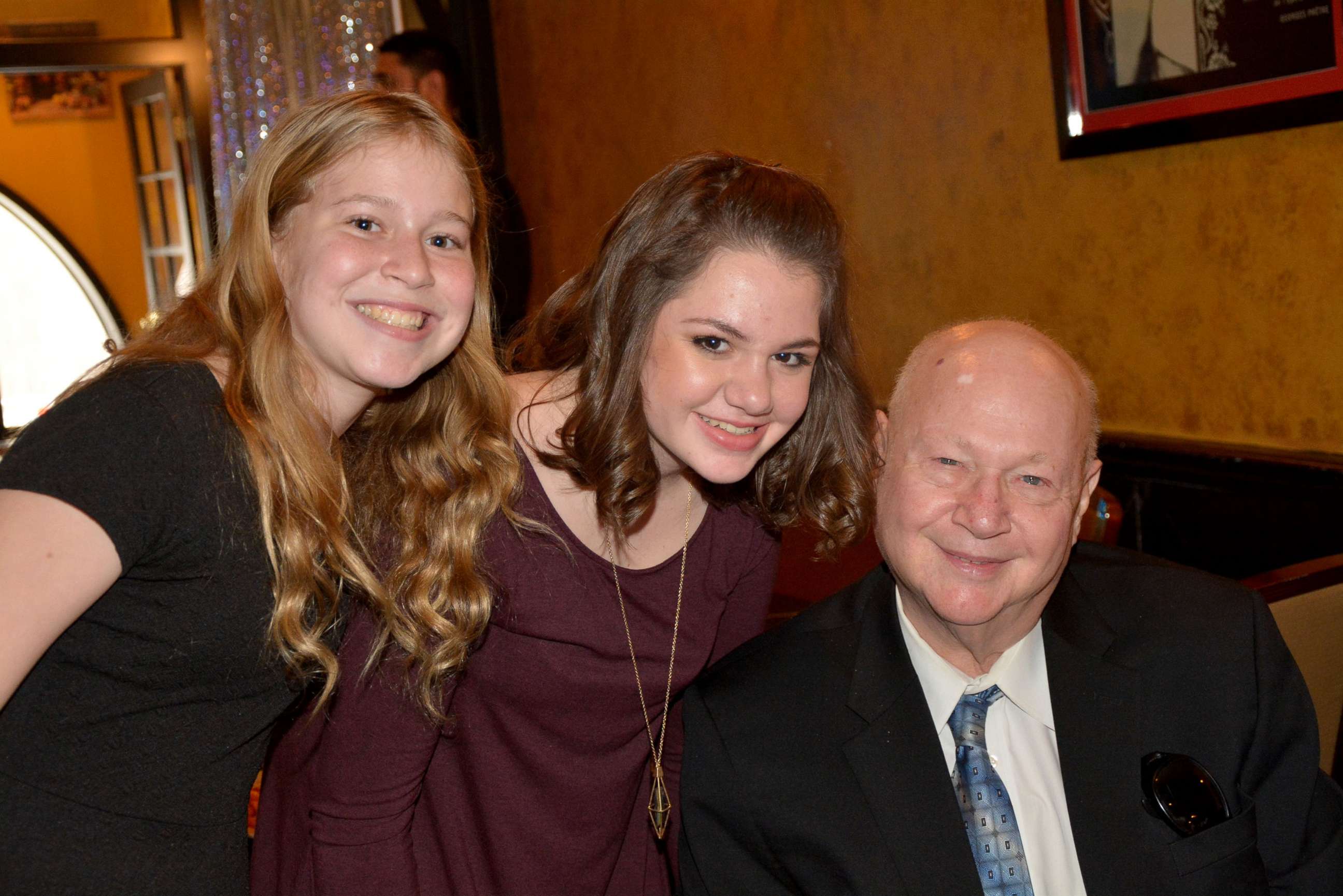 PHOTO: Carol Ackerman's father Stanley J. Teich, who passed away in April at 79, poses with two of his granddaughters.  