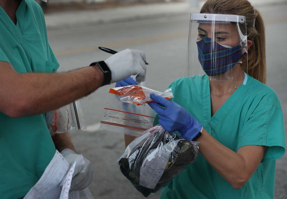 PHOTO: Dr. Natalia Echeverri, prepares to gather a sample to test for COVID-19 on April 17, 2020, in Miami.