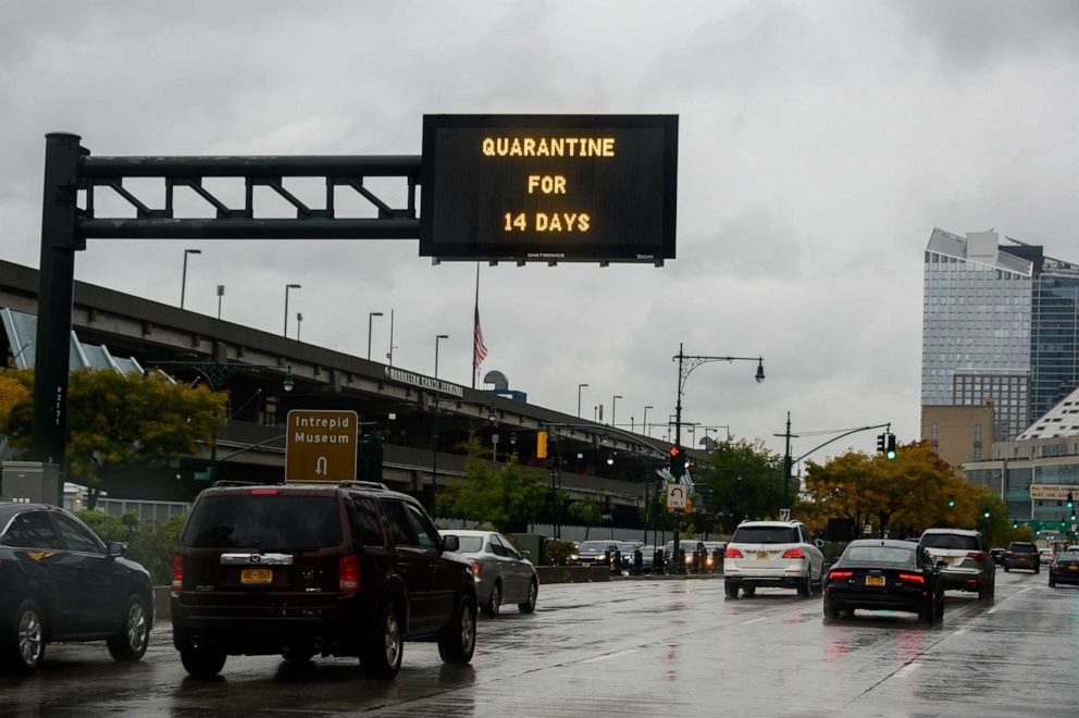 PHOTO: A traffic sign reads, "quarantine for 14 days" above the West Side Highway as the city continues the re-opening efforts following restrictions imposed to slow the spread of coronavirus in New York, Nov. 01, 2020.