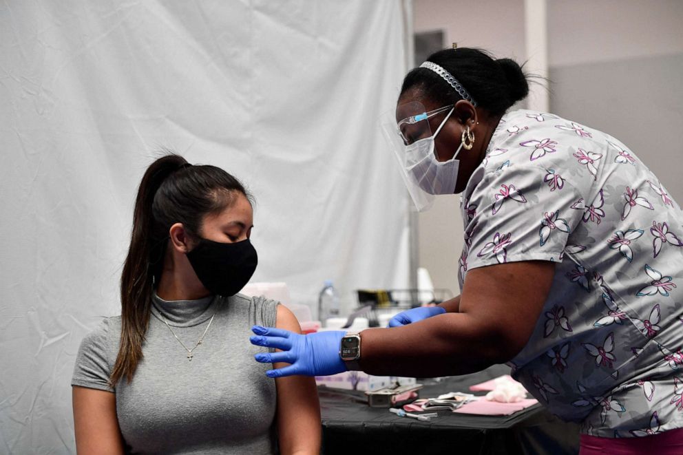 PHOTO: A nurse administers a dose of the Moderna Covid-19 vaccine at a clinic for Catholic school education workers including elementary school teachers and staff at a vaccination site at Loyola Marymount University, March 8, 2021, in Los Angeles.