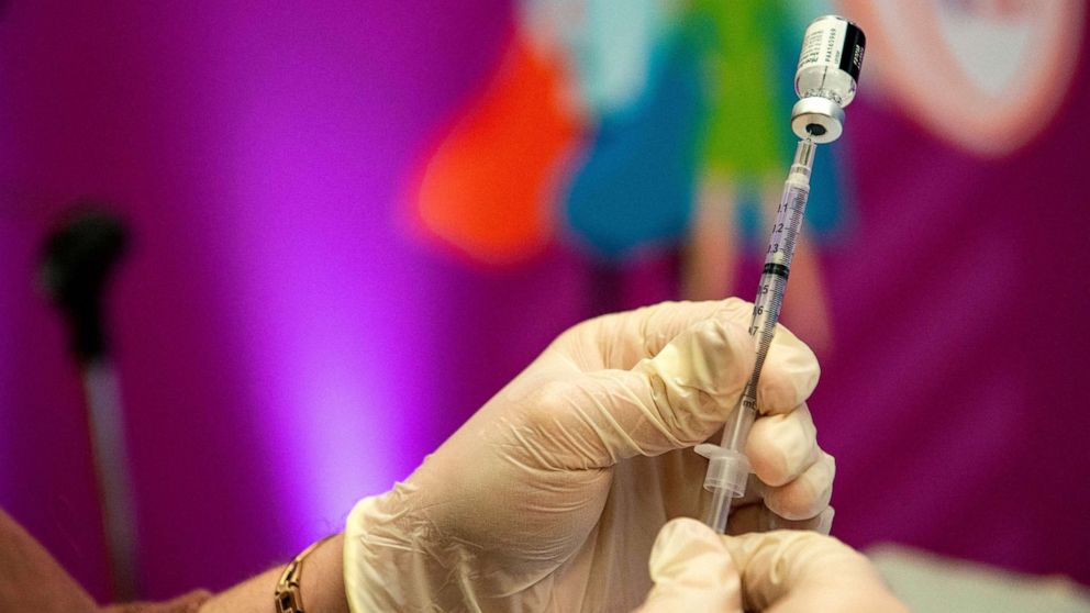 PHOTO: A medical worker prepares a Covid-19 vaccine booster at Hartford Hospital in Hartford, Conn., on Jan. 6, 2022.