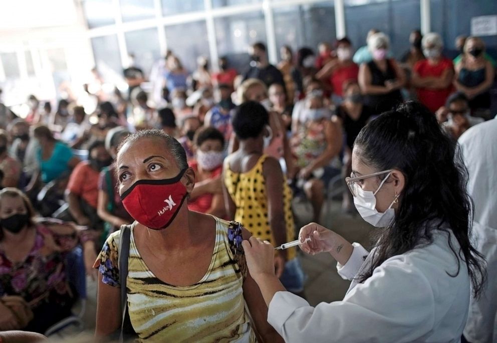 PHOTO: A healthcare worker administers the Sinovac COVID-19 vaccine in Rio de Janeiro, April 28, 2021. 