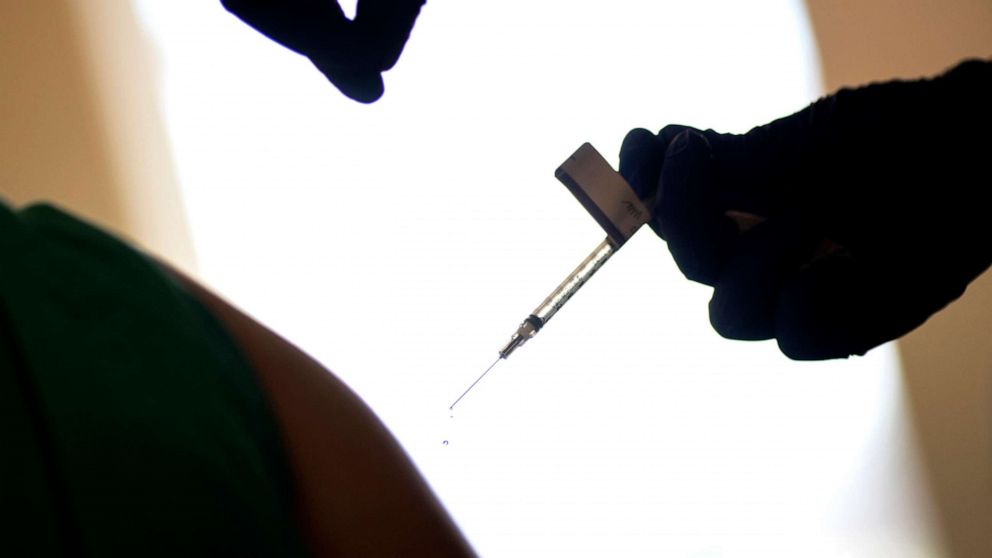 PHOTO: A droplet falls from a syringe after a health care worker was injected with the Pfizer-BioNTech COVID-19 vaccine in Providence, R.I., Dec. 15, 2020.