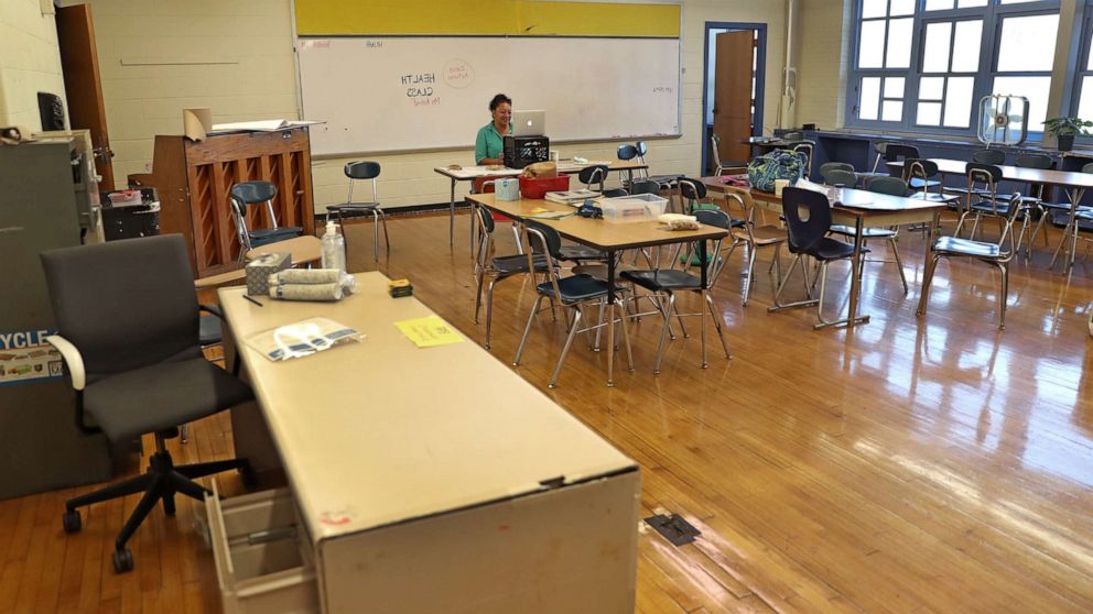 PHOTO: Ms. Nilo Ashraf, a health teacher, works on remote school with 7th and 8th grade students from an empty classroom at McCormack Middle School in Boston's Dorchester on Sept. 21, 2020.