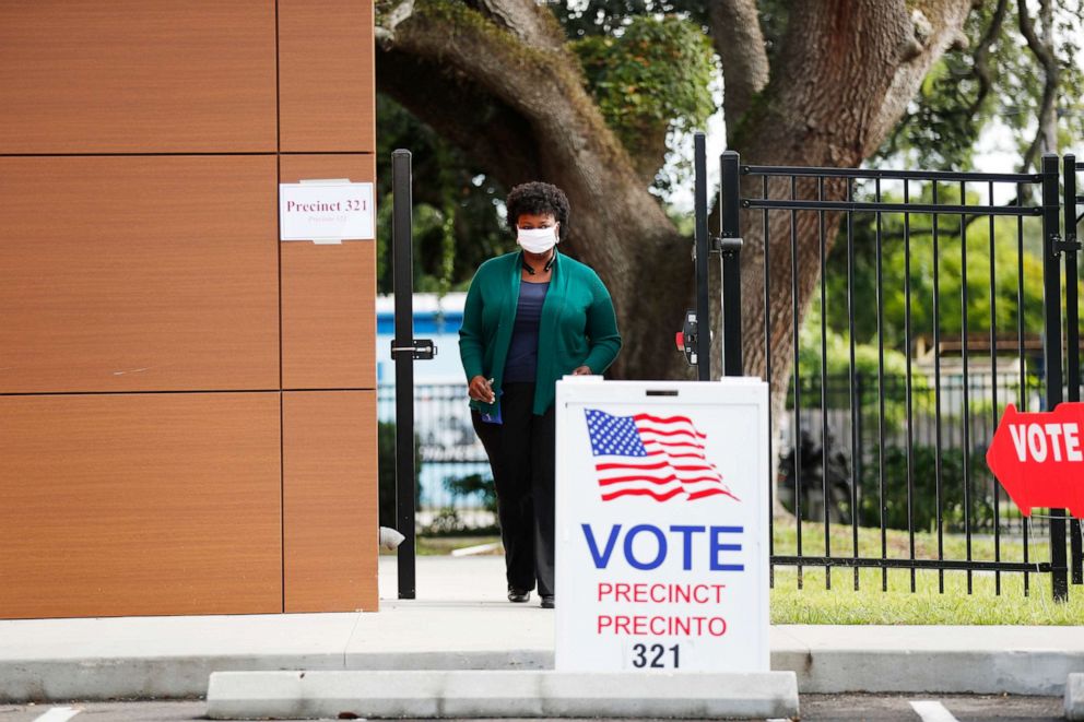 PHOTO: A voter exits the polling precinct after casting their ballot in Florida's primary election at Precinct 321 on Aug. 18, 2020 in Tampa, Fla.