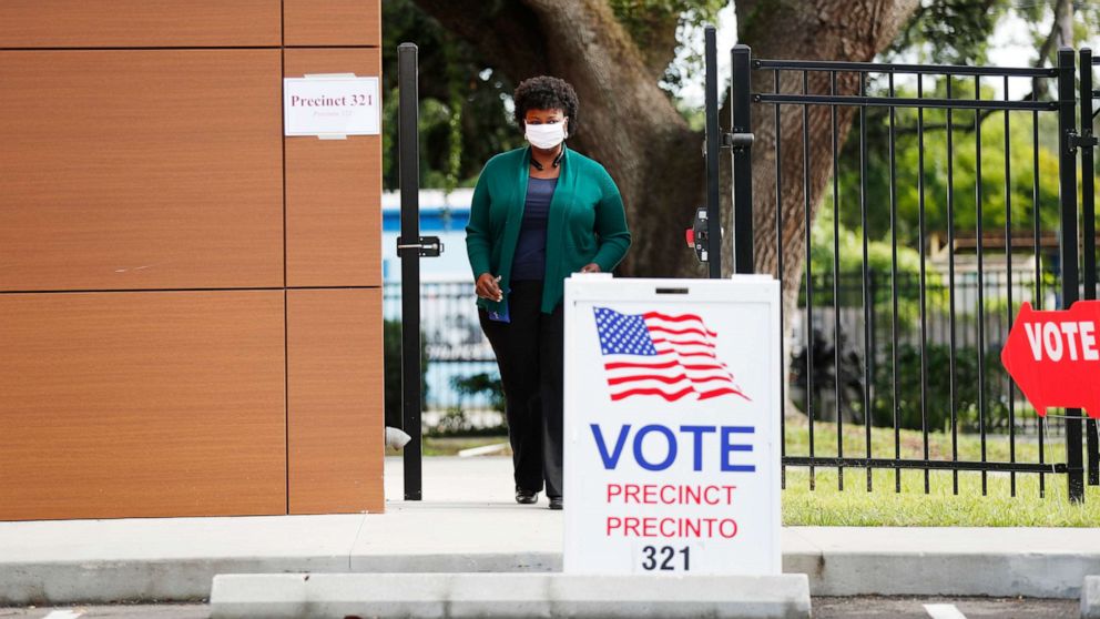 PHOTO: A voter exits the polling precinct after casting their ballot in Florida's primary election at Precinct 321 on Aug. 18, 2020 in Tampa, Fla.