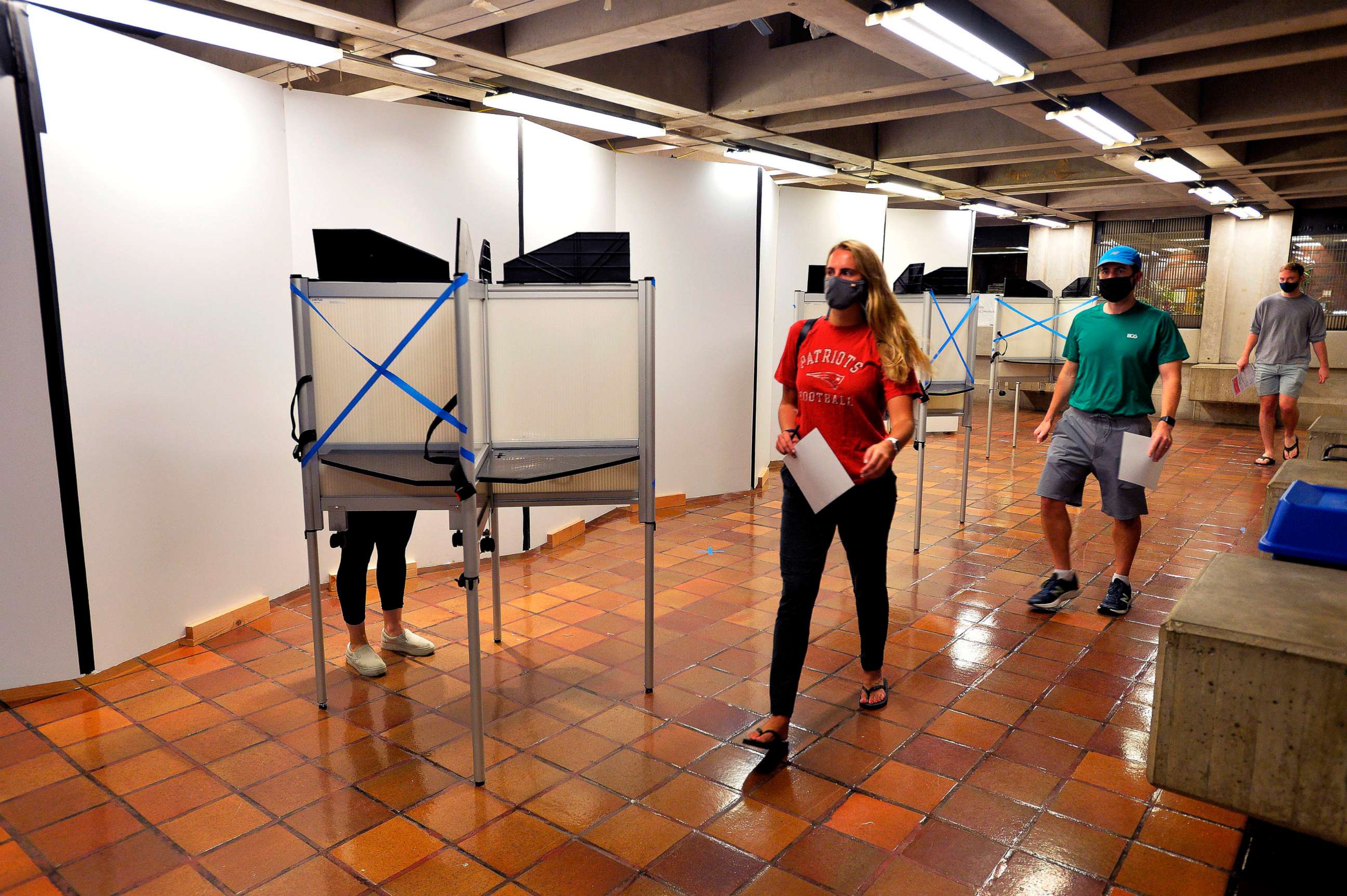 PHOTO: Voters with their ballots leave the polling booths at Boston City Hall during the Massachusetts State Primary on Sept. 1, 2020 in Boston.