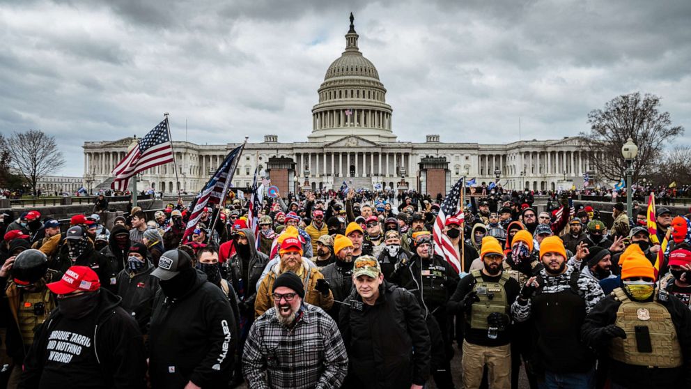 Capitol riot latest: man who allegedly dragged beaten officer down steps charged
