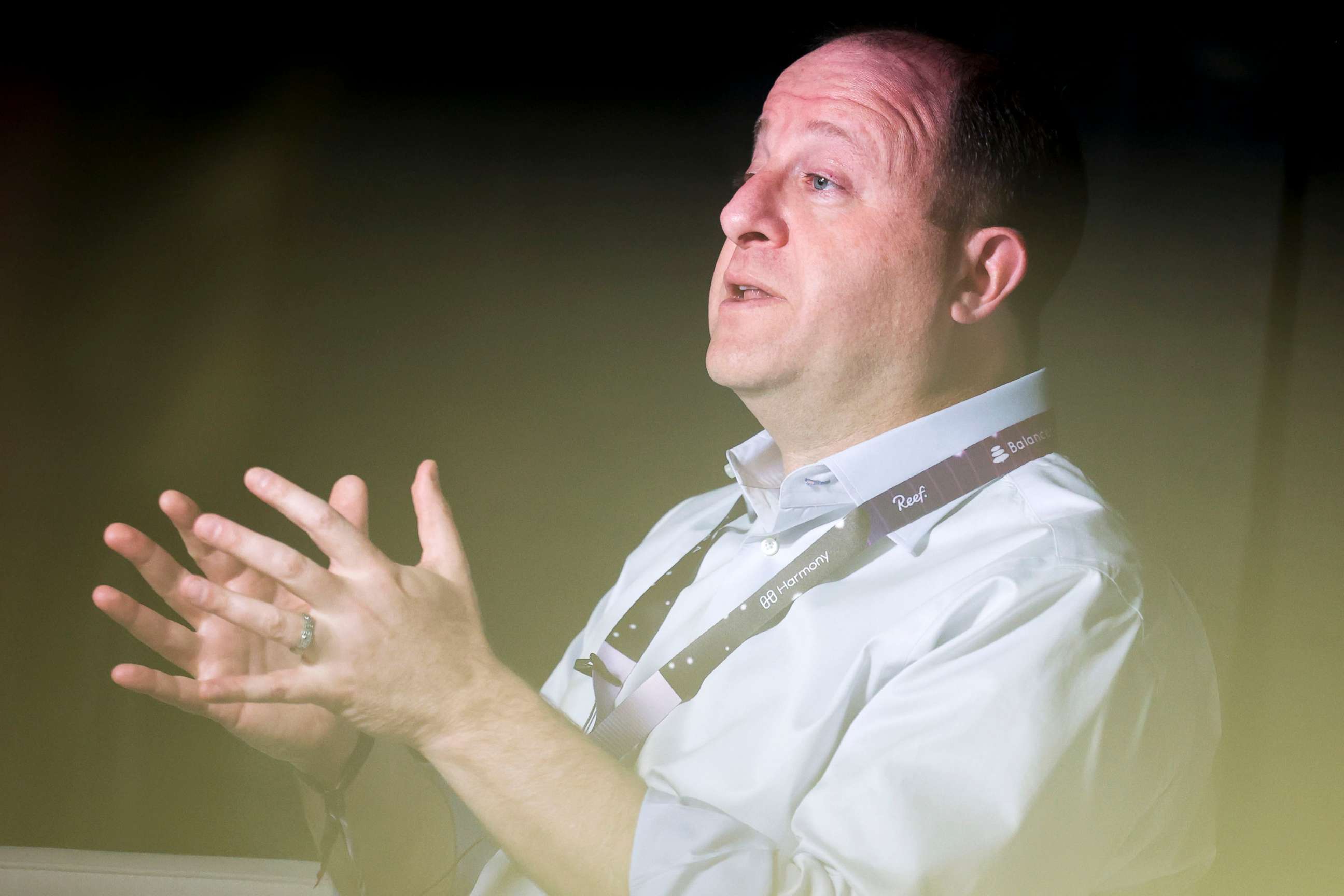 PHOTO: Colorado governor Jared Polis talks on a podcast at ETHDenver in Denver,  Feb. 18, 2022. 