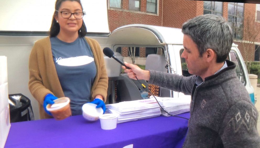 PHOTO: Crystal Mendoza, a food service worker with DC restaurant Little Sesame, hands out free meals to needy families in the nation's capital.