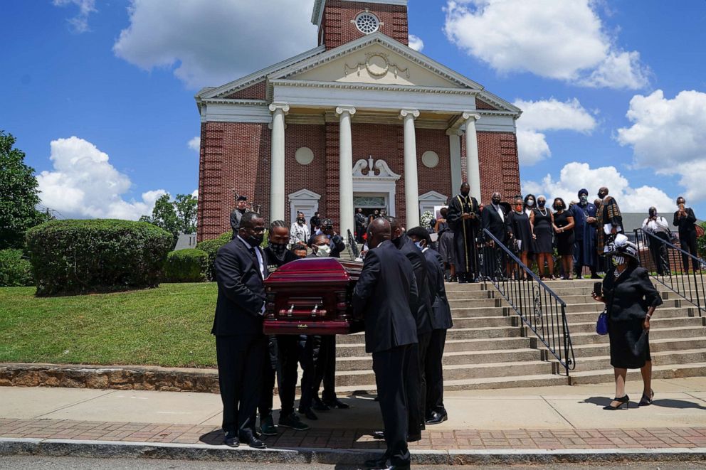 PHOTO: The casket holding the body of civil rights icon C.T. Vivian is carried out of Providence Missionary Baptist Church following his funeral service on July 23, 2020 in Atlanta, Georgia.