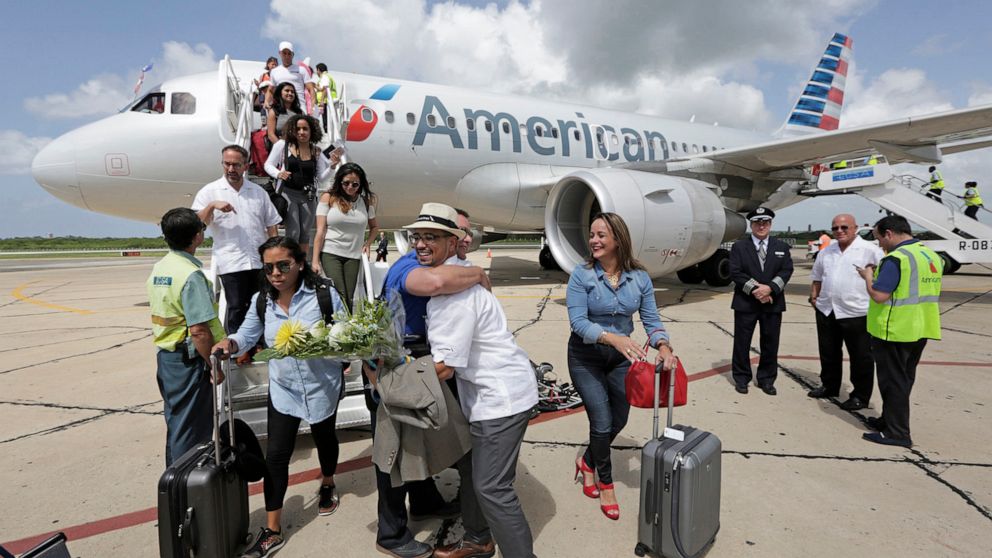 PHOTO: An American Airlines executive greets travel agents on the tarmac as they arrive in Cienfuegos on American Airlines' inaugural scheduled service from Miami to Cuba in Sept. 2016.