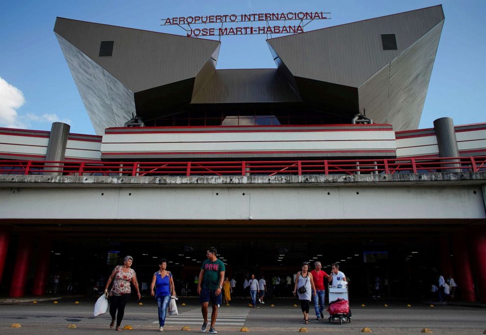 PHOTO: People walk at an entrance of the Jose Marti International Airport in Havana, Cuba, Sept. 25, 2019.