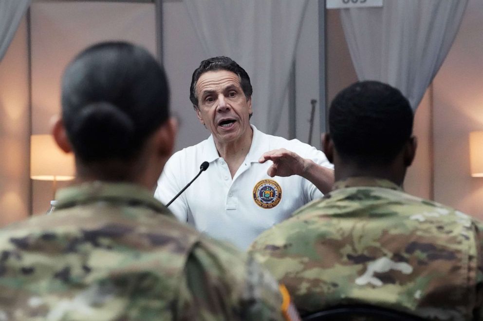 PHOTO: National Guard troops listen as New York Governor Andrew Cuomo speaks to the press at the Jacob K. Javits Convention Center in New York, March 27, 2020. 