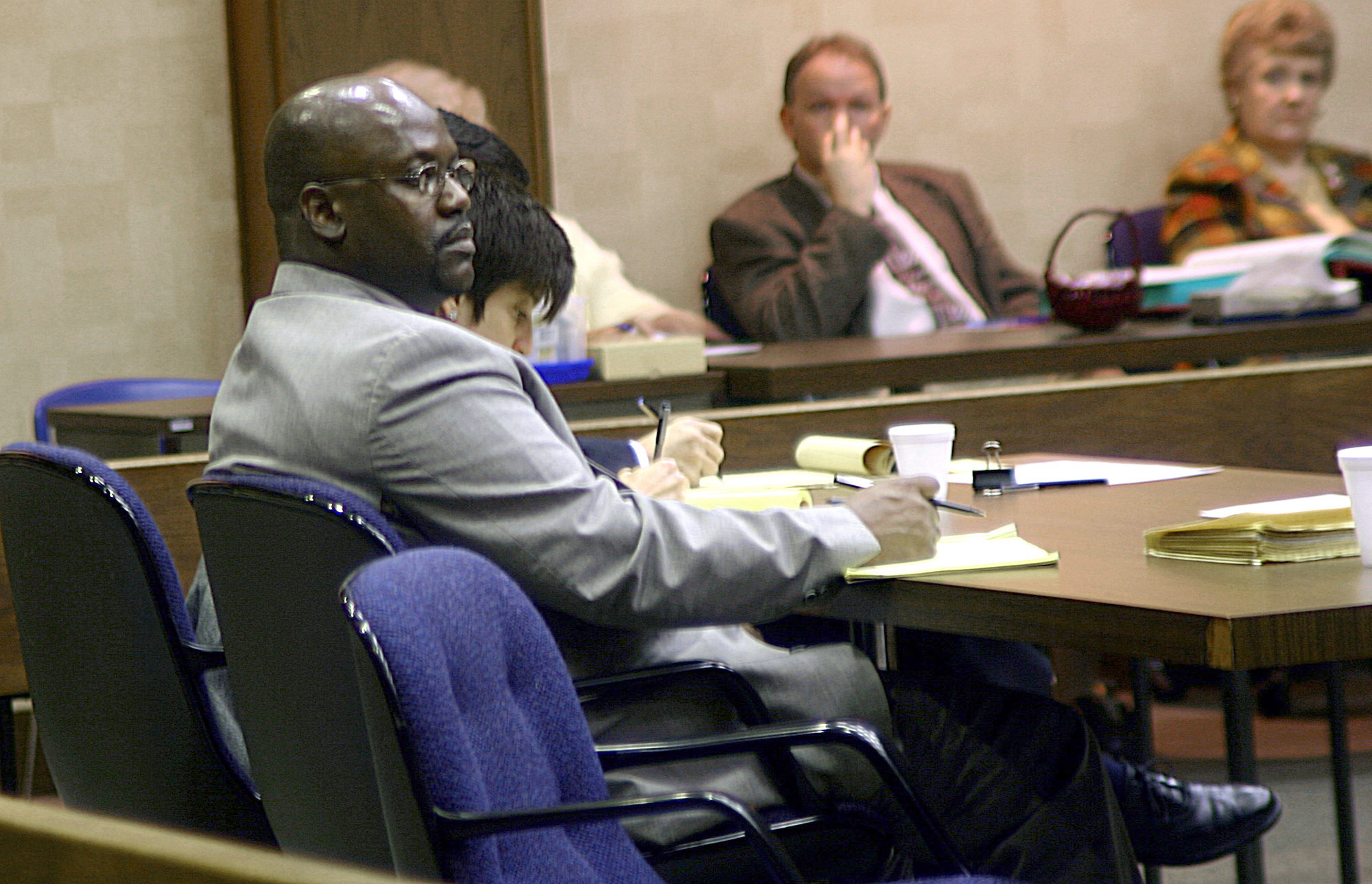 PHOTO: Curtis Giovanni Flowers, left, listens to testimony in his third capital murder trial in Winona, Miss., Feb. 6, 2004.