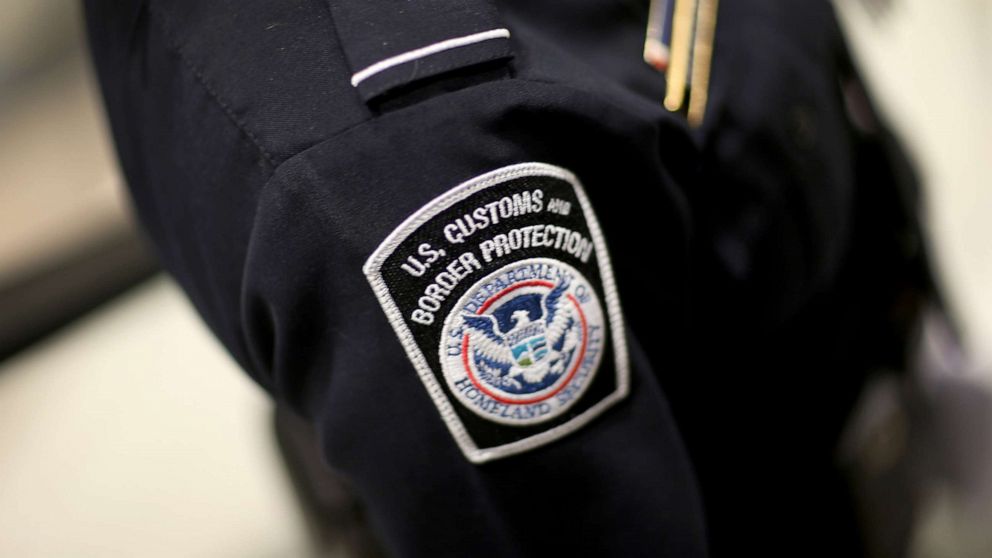 PHOTO: A U.S. Customs and Border Protection officer's patch is seen as they unveil a new mobile app for international travelers arriving at Miami International Airport, March 4, 2015 in Miami. 