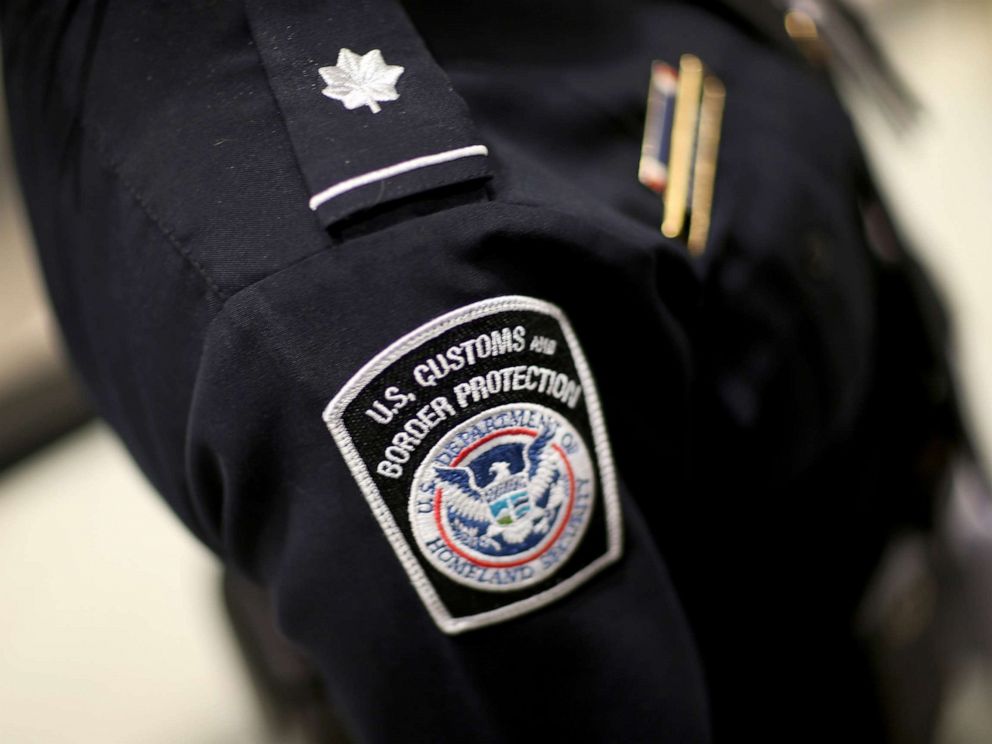 PHOTO: A U.S. Customs and Border Protection officers patch is seen as they unveil a new mobile app for international travelers arriving at Miami International Airport, March 4, 2015 in Miami.