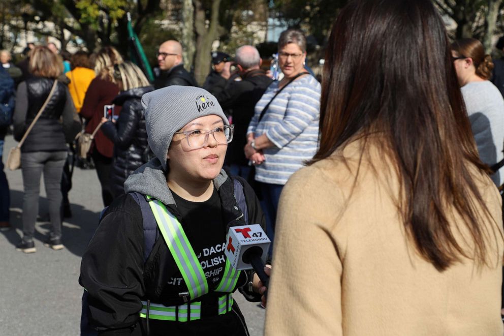 PHOTO: Carolina Fung Feng of New York City, a DACA recipient, speaks with a reporter before embarking on a march to the Supreme Court in Washington, D.C., on Oct. 26, 2019.