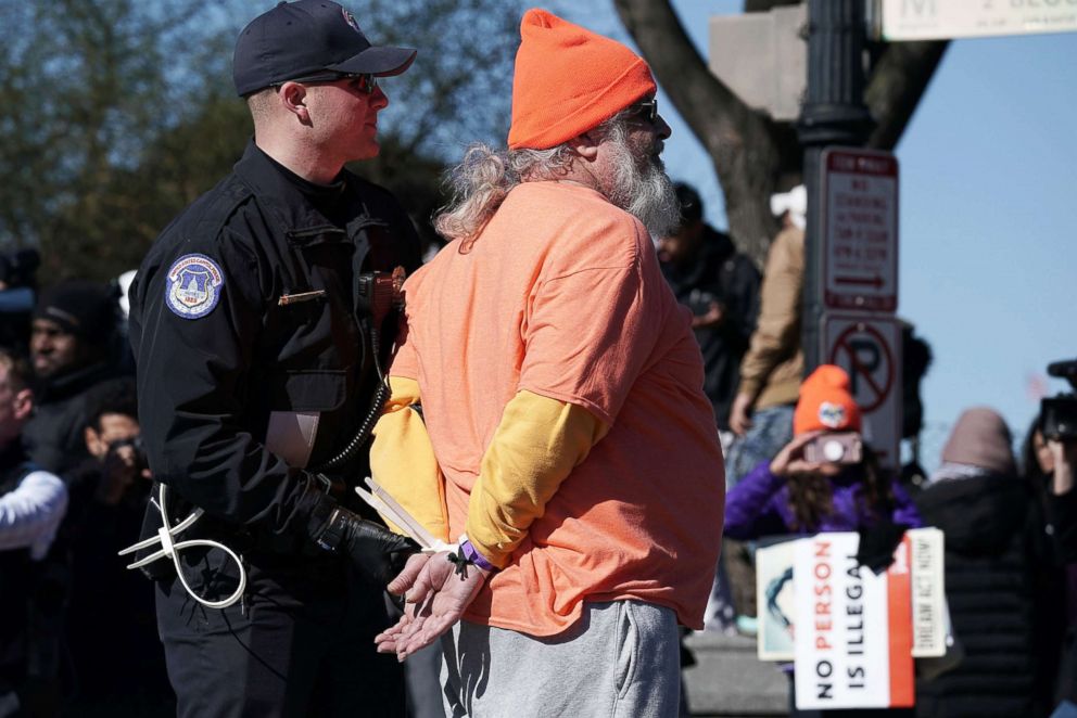 PHOTO: An immigration activist is arrested by U.S. Capitol Police as protesters shut down Independence Avenue on March 5, 2018, on Capitol Hill