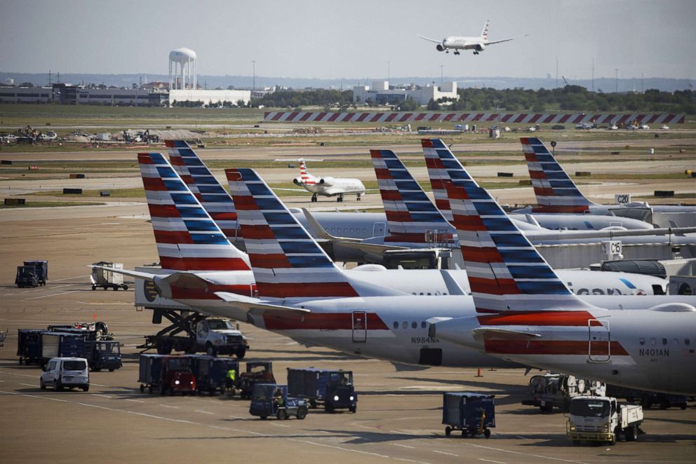 PHOTO: American Airlines Group Inc. airplanes stand at passenger gates at Dallas/Fort Worth International Airport (DFW) near Dallas, Texas, on Oct. 1, 2020.
