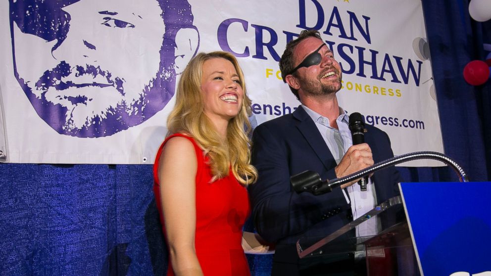 PHOTO: In this Tuesday, May 22, 2018, file photo, Republican congressional candidate Dan Crenshaw reacts to the crowd with his wife, Tara, as he comes on stage to deliver a victory speech during an election night party at the Cadillac Bar, in Houston. 