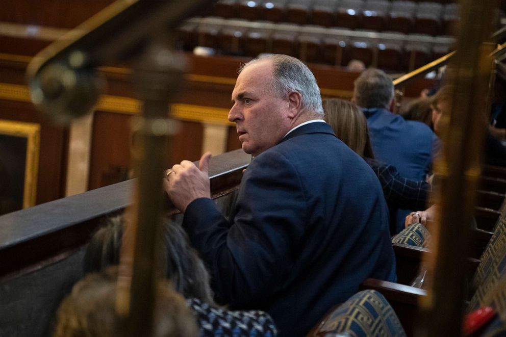 PHOTO: Rep. Dan Kildee and other members take cover as protesters attempt to break into the House chamber during the joint session of Congress to certify the Electoral College vote, Jan. 6, 2021.