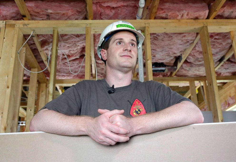 PHOTO: Democratic congressional candidate Dan McCready leans against wallboard as he pauses during a Habitat For Humanity building event in Charlotte, N.C., Sept. 26, 2018.