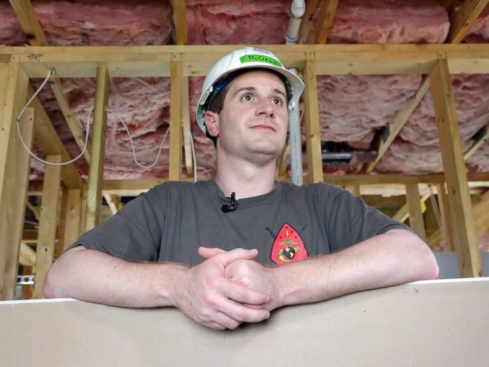 PHOTO: Democratic congressional candidate Dan McCready leans against wallboard as he pauses during a Habitat For Humanity building event in Charlotte, N.C., Sept. 26, 2018.