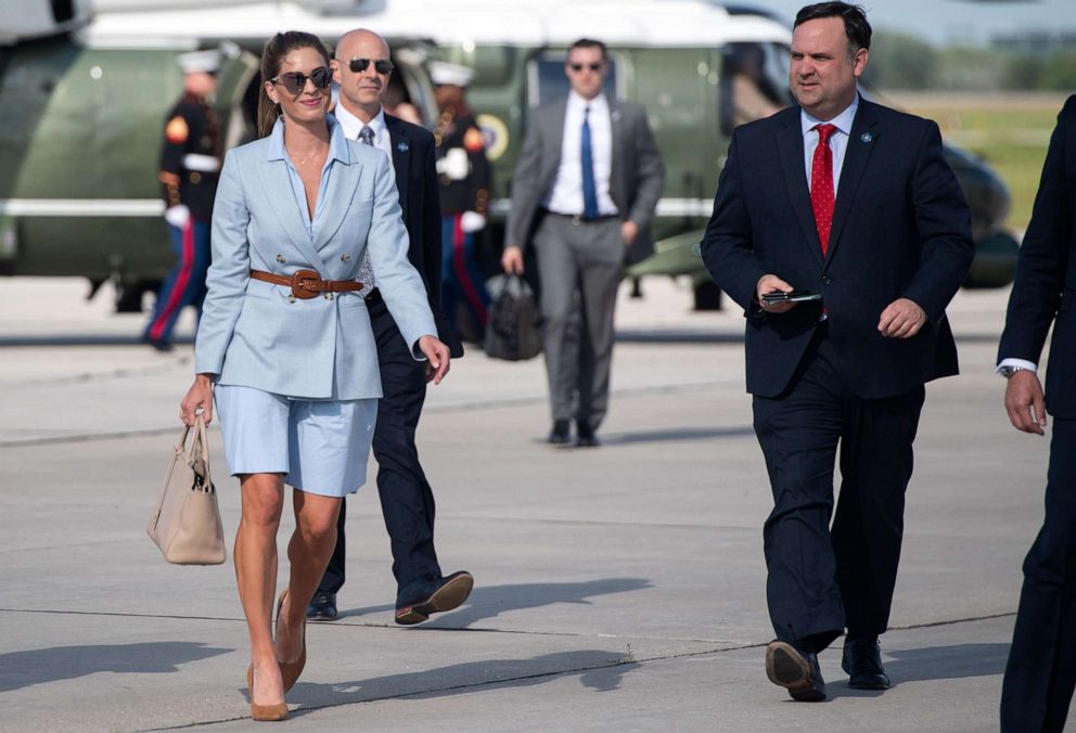 PHOTO: Counselor to the President Hope Hicks, left,  and White House social media director Dan Scavino, right, arrive to board Air Force One in Green Bay, Wisconsin, June 25, 2020.