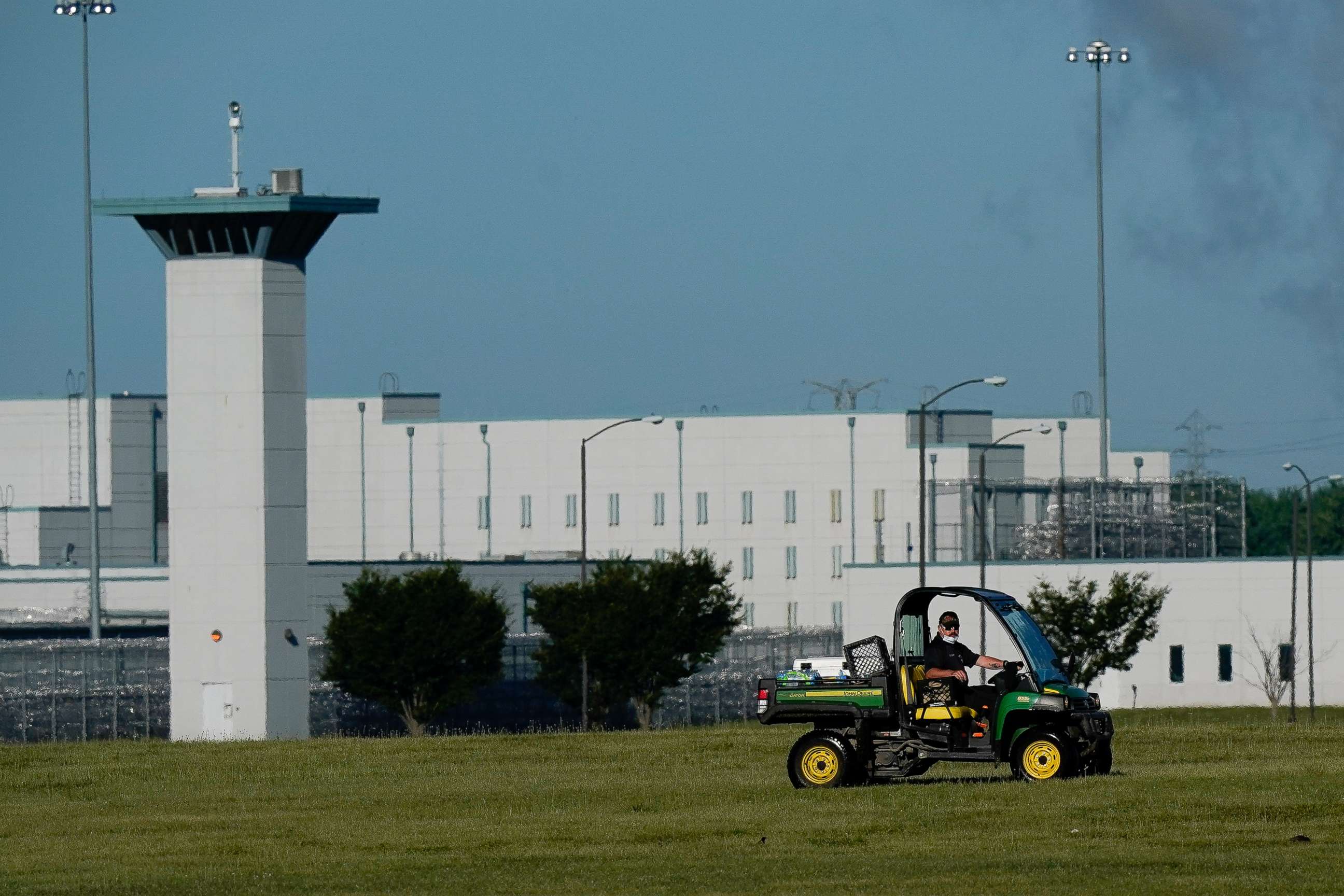 PHOTO: A corrections officer patrols outside the Federal Correctional Institution, Terre Haute, Ind., July 13, 2020.